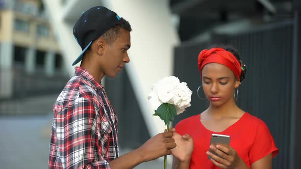 Teen Girl Unknowingly Taking Flowers From Boy, Digital Nation Addicted to Gadget