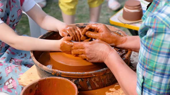 Woman and Girl Making Ceramic Pot in Pottery Workshop