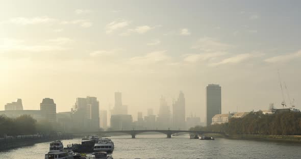 Timelapse of iconic London City Skyline and River Thames, time lapse of clouds moving at sunset over