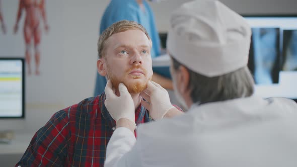 Doctor Checking the Lymph Nodes Size of Patient