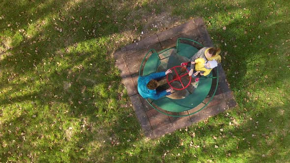 Aerial view of family enjoying day at merry-go-round, Zagreb, Croatia.