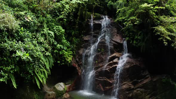 A beautiful waterfall named suyupacha found in a tropical forest