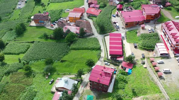 aerial top down view of a residential area full of hotels and apartments in Uzungol Trabzon on a sun