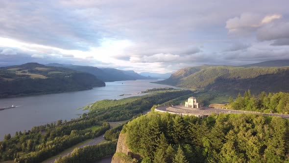 Aerial flying above Vista House at Crown Point and revealing the scenic Columbia River Gorge.