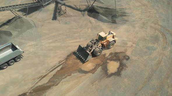 Excavator and Dump Truck at Quarry Top View