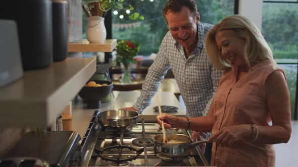 Happy couple cooking together