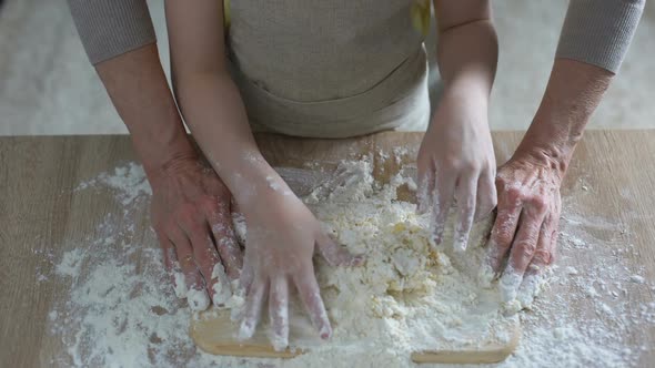 Little Girl Hands Helping Her Grandmother to Knead Dough, Traditional Recipe