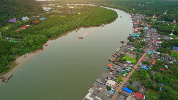 Aerial Shot of Local Fisherman Village Beside the sea.