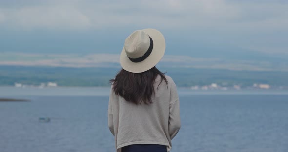 Woman look at the sea and mountain