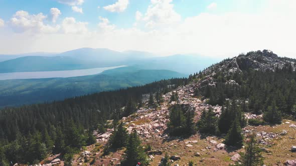 Landscape of Nature - Rocky Mountains and a Forest - People Hiking