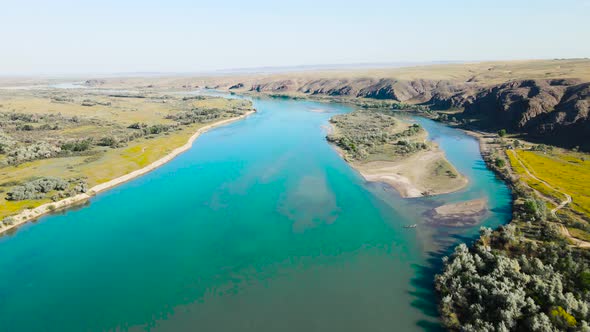 Drone Shot of River and Mountains at Sunset in Kazakhstan