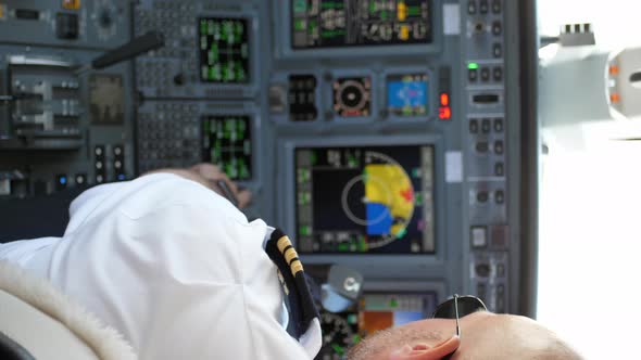 Pilot Working in Aircraft Cockpit during Preflight, Vertical Video.