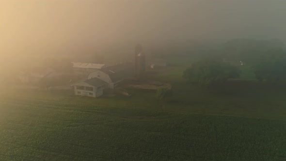 Aerial View of a Foggy Morning Looking Over Pennsylvania Farmland, Fields