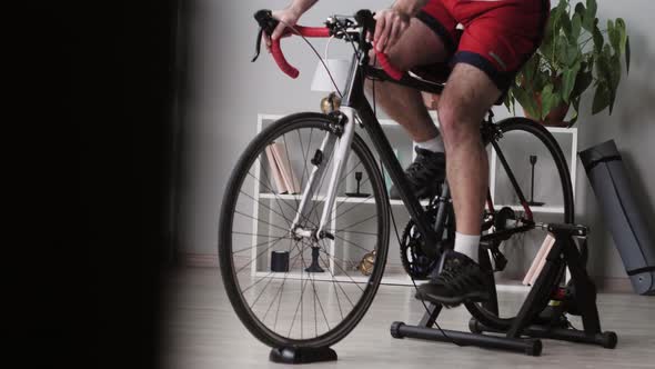 Sportsman Riding Bicycle Home Gym