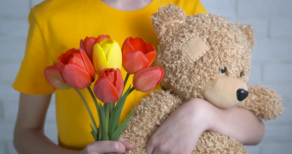 Flowers in the hands of a child. 