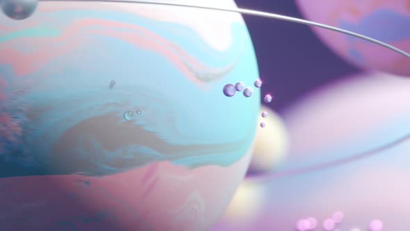 Animation with bright, pastel, colorful planets and shiny spinning moons.