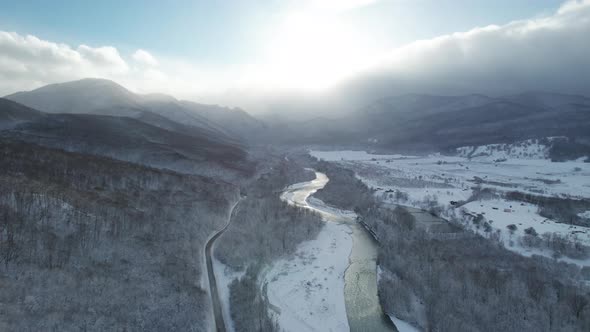 Aerial View of Plateau LagoNaki Mountain Twisted Road in the Winter and Driving Car
