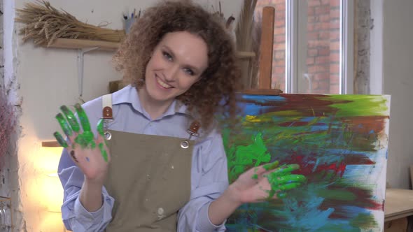 Portrait of a Happy Modern Female Artist in a Creative Workshop