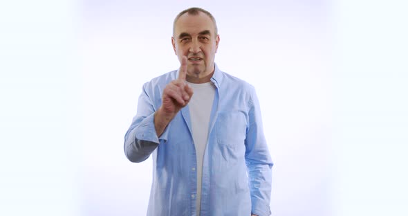 Man Saying No By Waving His Finger on White Background.