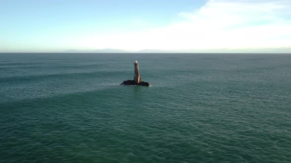 Flying towards and over the Karori Rock Lighthouse in the Cook Strait, New Zealand