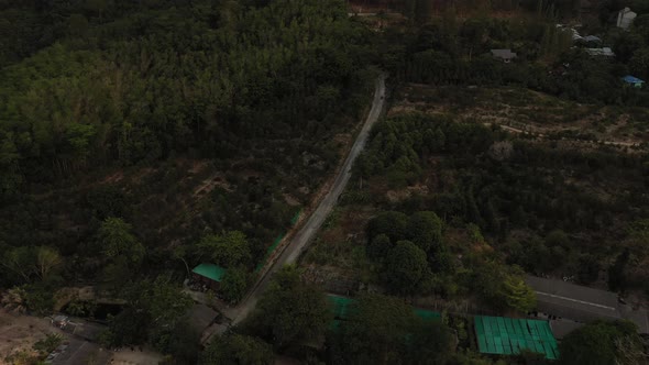 Drone Flight Over the Jungle and Sea City After Sunset