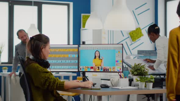 Professional Woman Retoucher Edits Assets in Creative Media Agency Office