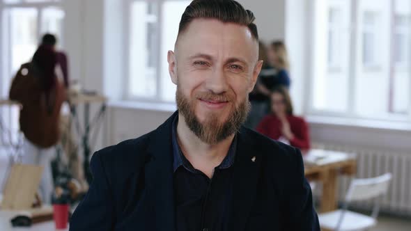 Close-up Happy Middle Aged Boss Businessman in Black Formal Suit Cheerfully Smiling at Camera at