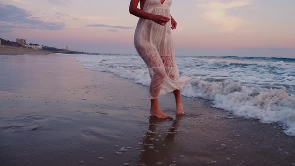 Attractive Woman Enjoying The Beach At Sunset