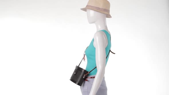 Mannequin in Turquoise Top Rotating.