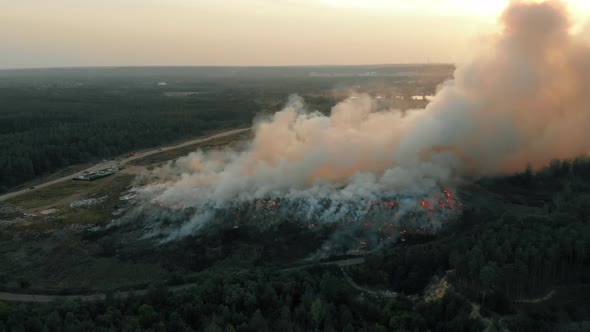 Aerial View at Fire at Garbage Dump, Burning Pollutes the Environment. Ecological Catastrophe and