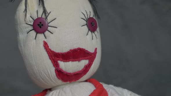 Scary smiling doll made of cotton and velvet  fabric slow panning 4K 2160p UltraHD footage - Misteri