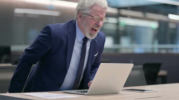 Old Businessman with Laptop Having Back Pain