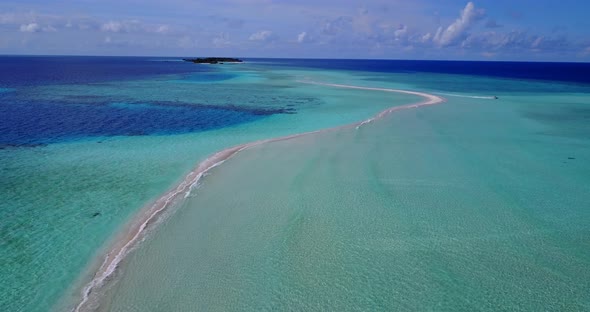 Tropical fly over travel shot of a summer white paradise sand beach and aqua blue water background i