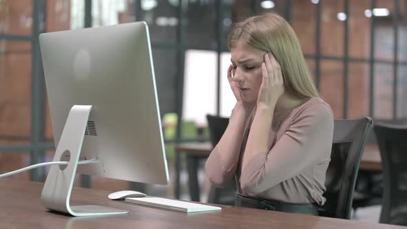 Tired Woman Having Headache While Working on Computer