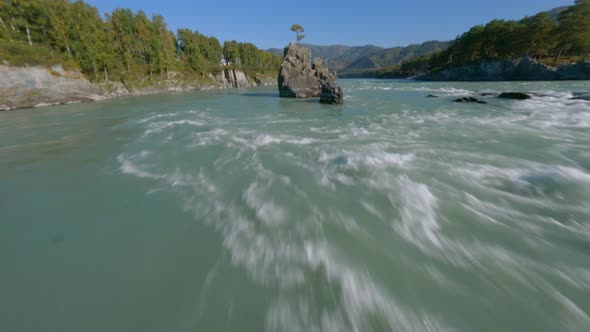 Speed Extreme Flight FPV Drone Mountain Wavy Water Flow Natural Sharp Cliff Island Tree Sunny Beam