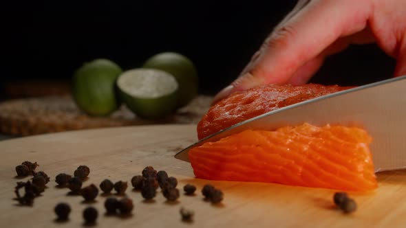 Woman's Hand Cut Red Salted Fish Into Chunks While Cooking Cooking Sandwiches Using Red Salmon Fish