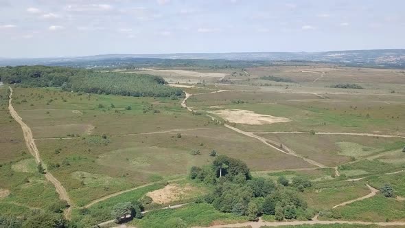 Wide aerial view of natural fields in Woodbury England.