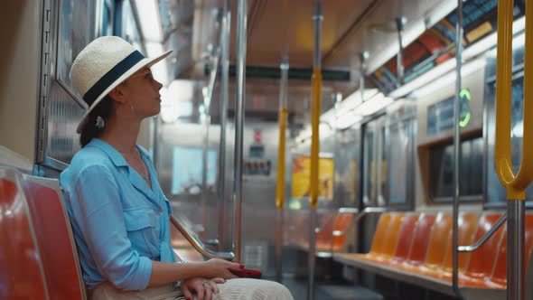 Young woman in a subway train, NYC