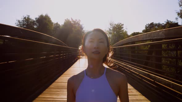 Attractive asian woman going for her morning run alt