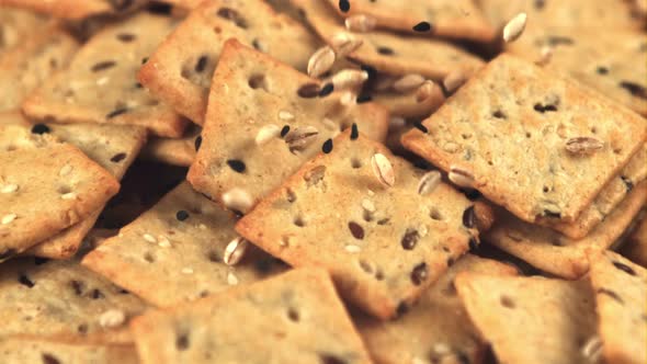 Super Slow Motion on the Cookies are Falling Grains of Sesame and Barley