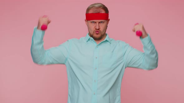 Young Adult Man Making Fitness Exercises with Dumbbells Alone Working Out Pumping Up Arm Muscles