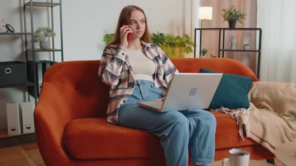 Young Woman Using Laptop Computer Sitting on Sofa Working Online Shopping From Home Office