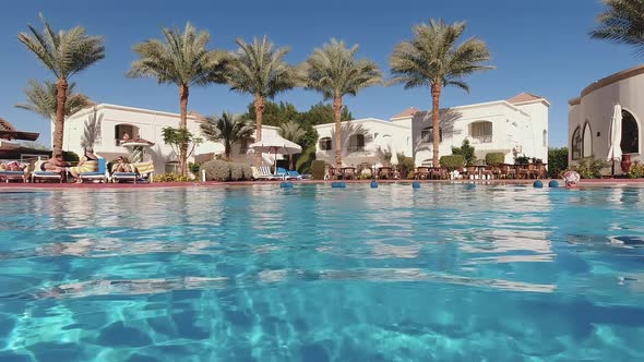 Egypt Sharm El Sheikh 02072020 Swimming Pool with Blue Clear Water in the Hotel and Green Palm Trees