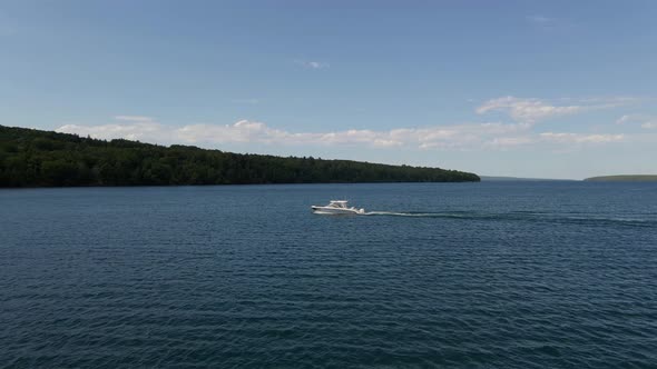 Boat sailing into Bayfileld Wisconsin aerial view summer time