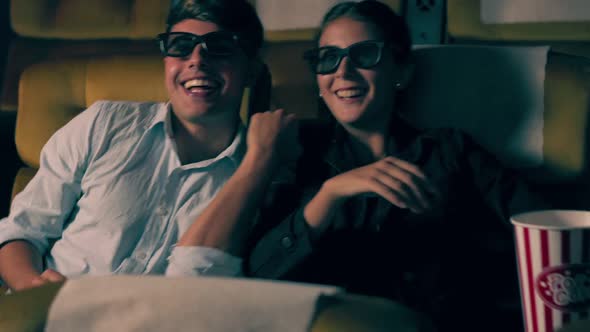 Man and Woman in the Cinema Watching a 3D Movie