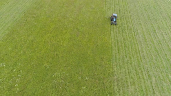 Tractor Mows Grass