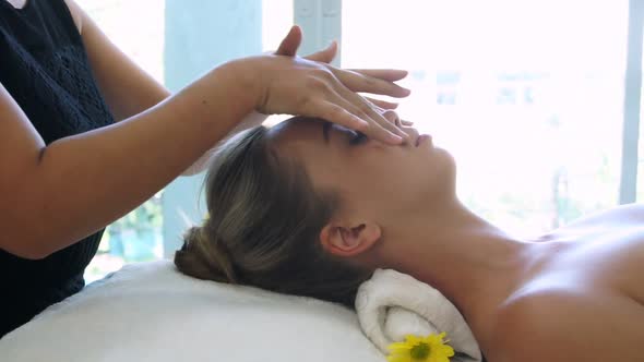 Woman Gets Facial and Head Massage in Luxury Spa