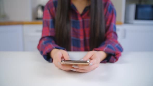 Girl using social media app on modern mobile phone