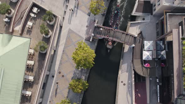 Moleiceiro touristic tour along urban canal of Ria de Aveiro, Portugal. Top down aerial view