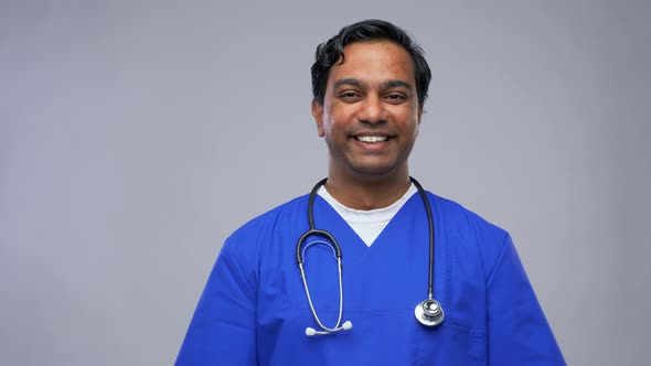 Indian Doctor or Male Nurse in Blue Uniform